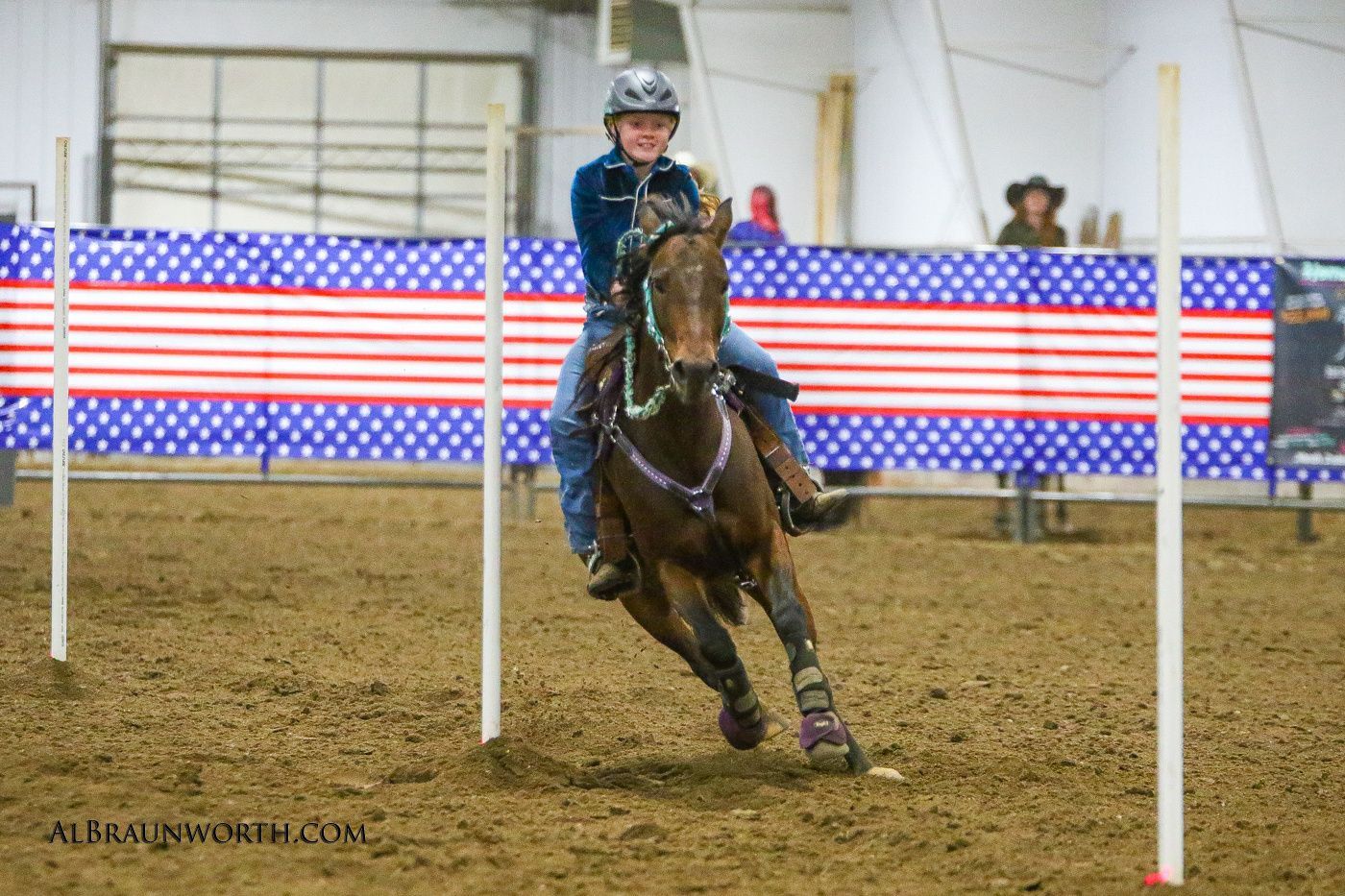 A Youth rider running the poles
